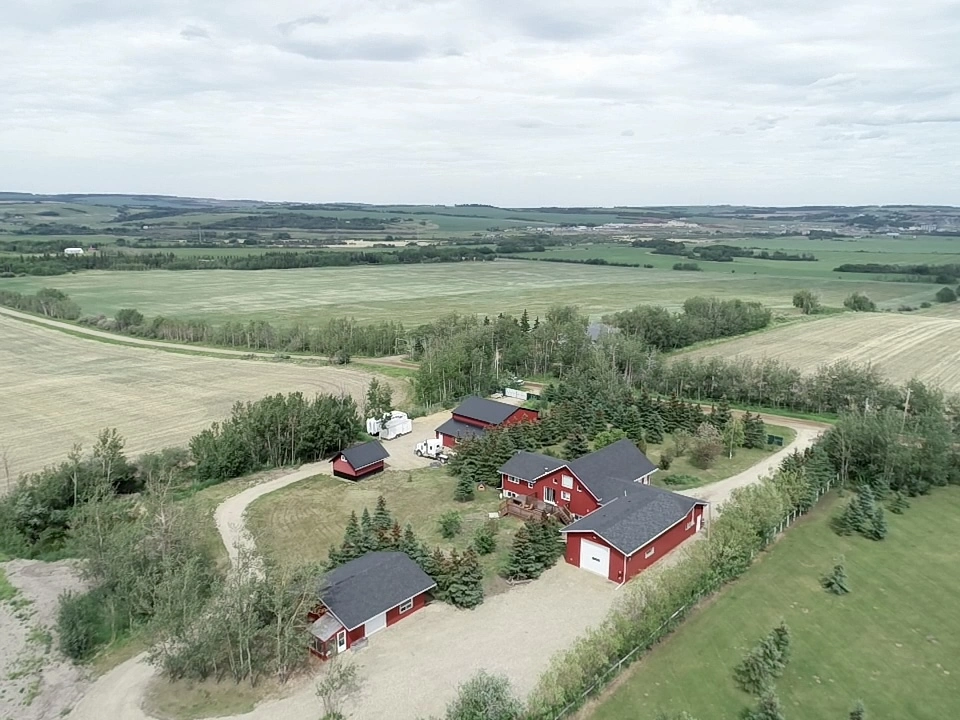 aerial-view-of-a-staged-red-rural-property-for-sale